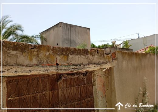 à vendre terrain cloturé